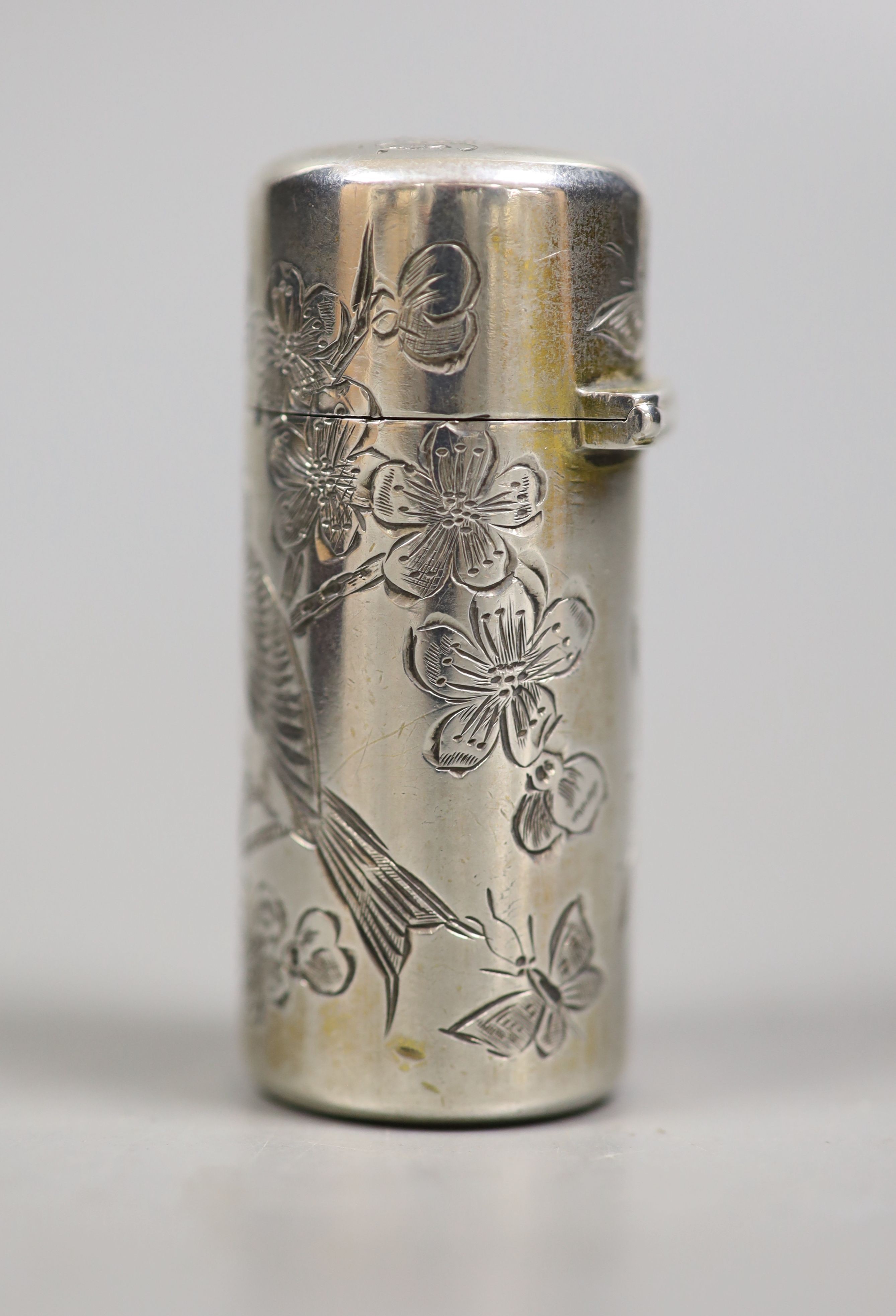 A cased late Victorian silver cylindrical scent bottle, with engraved initials and aesthetic decoration, Sampson Mordan & Co, London, 1882, 53mm.